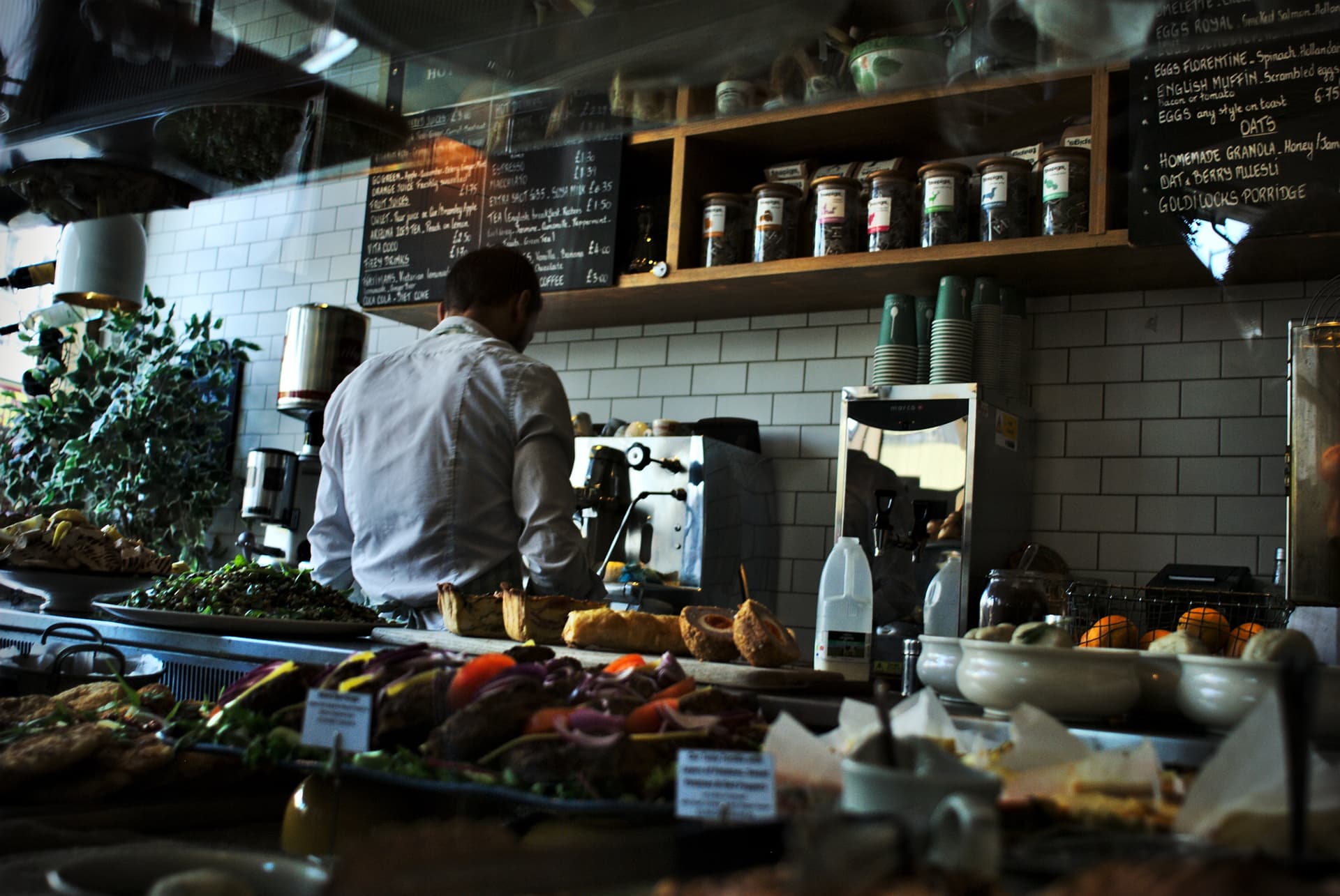 busy cafe with barista working