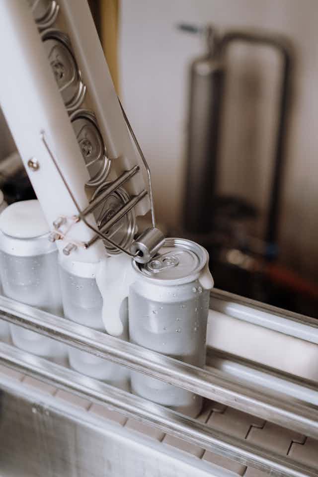 canned beverages being made in factory