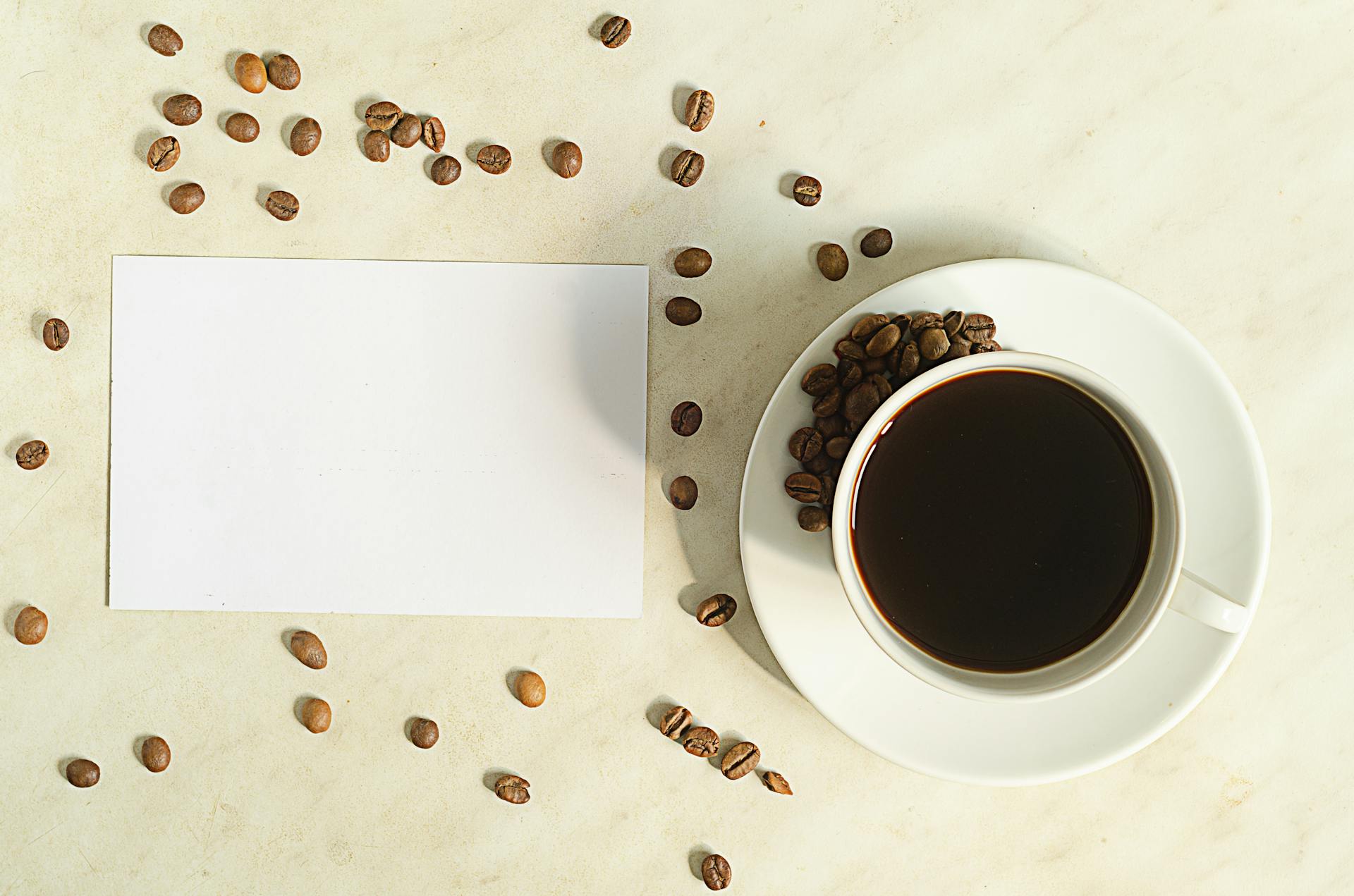 coffee cups and beans with blank slate